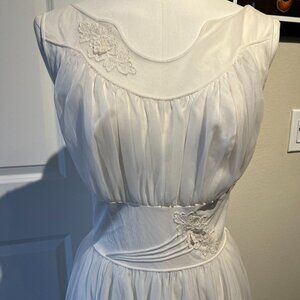 Sheer vintage 1950s dress, excellent condition. Embroidery on the chest & waist.